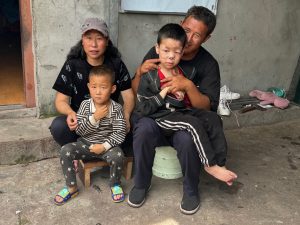 picture of boy with undiagnosed disability with his parents and little brother