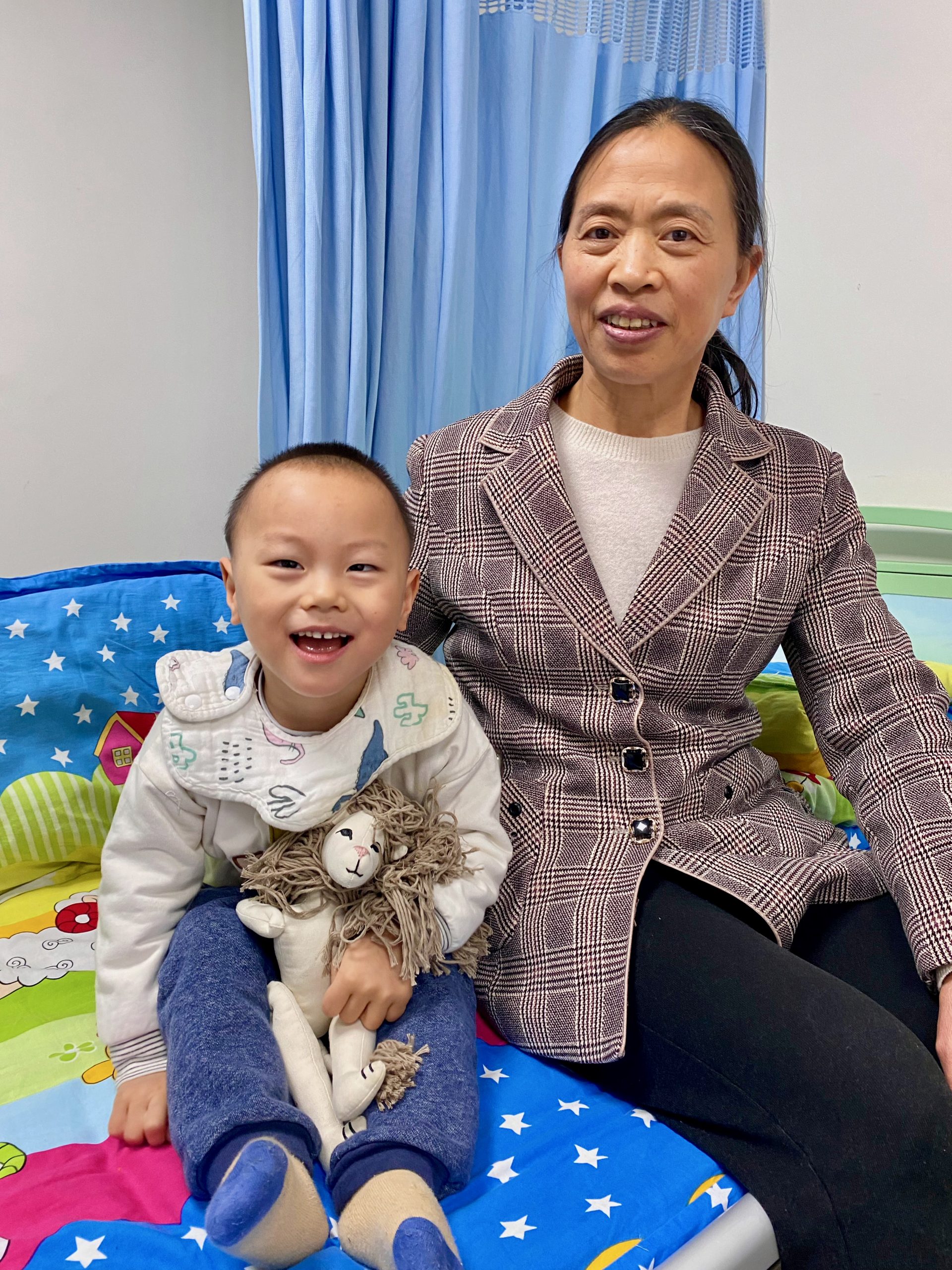Child with Cerebral Palsy and his grandma in China in the hospital