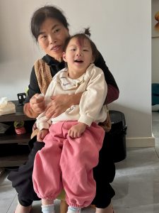 little girl with disability and her grandma